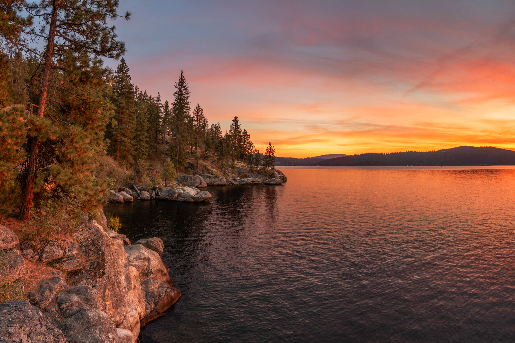 Sparkling Coeur d'Alene Lake with mountain backdrop