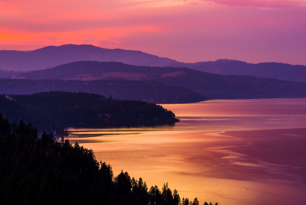 Clear mountain water and forested peaks at Coeur d'Alene Lake