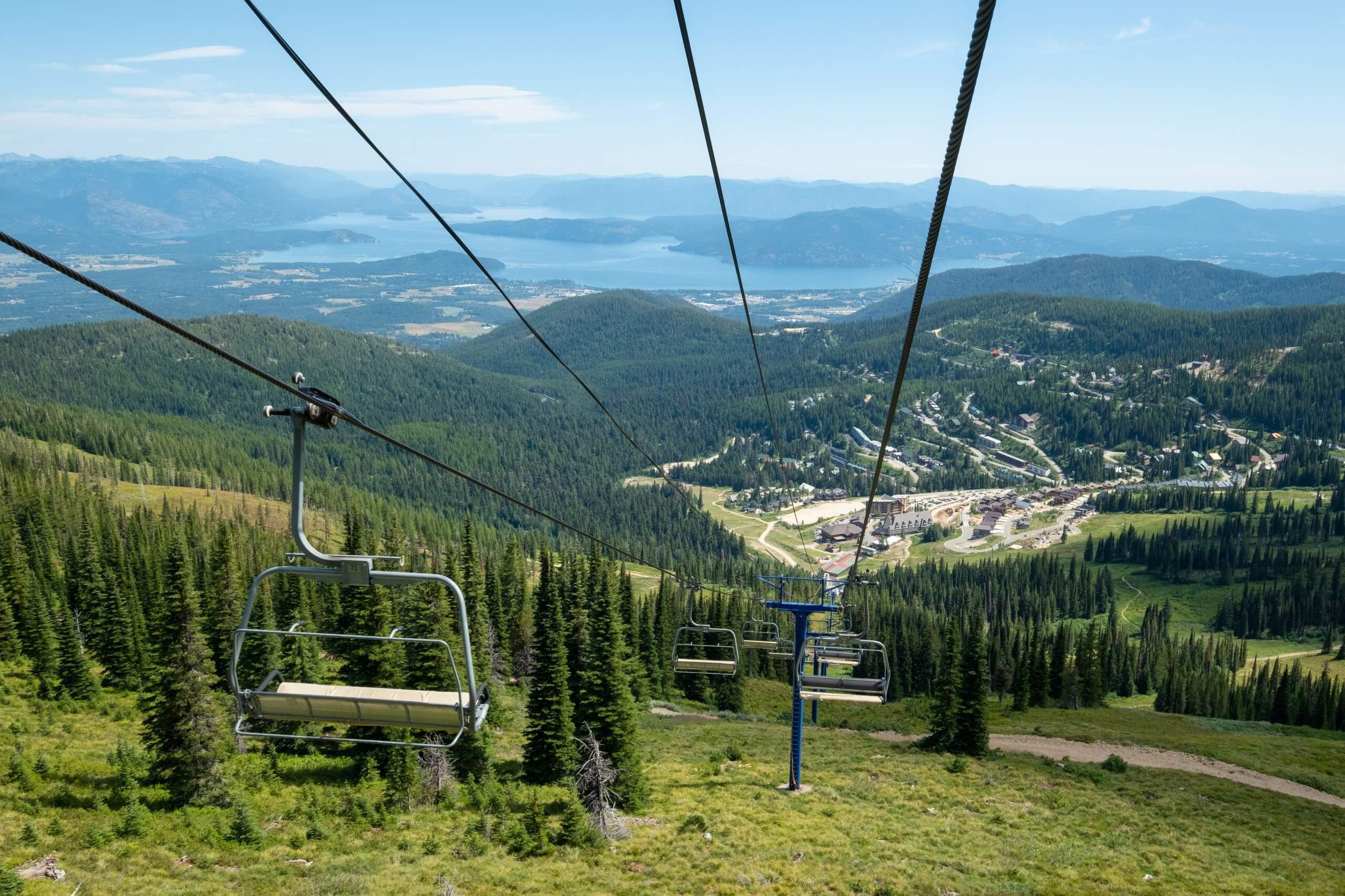 Snowy Schweitzer village with skiers and an open-air pool in winter
